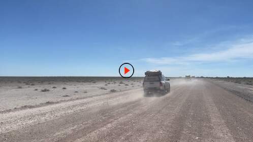 camping cars driving on gravel road