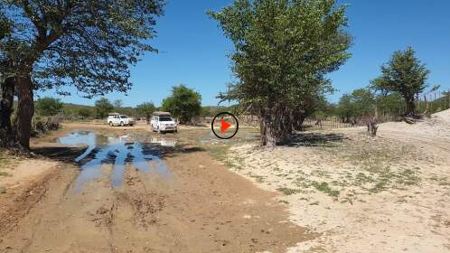 camping cars driving through mudpond