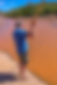 Marc testing water depth in river