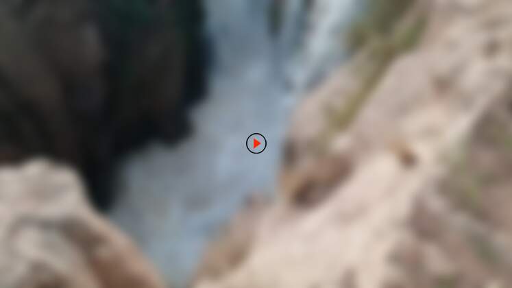 main waterfall dropping into narrow gorge