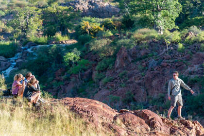 Simon showing river to Jojo, Julien & Manon