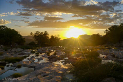 rocky river at sunset