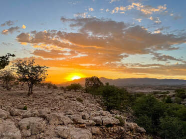 rocky hill at sunset