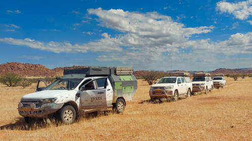 ranger camper & camping cars on track in grassy plain