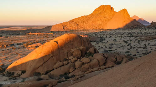 plain with granite rocks at sunrise