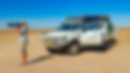 Paul taking pictures near ranger camper