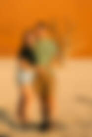 Mathou & Simon hugging at sunset