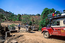 Paul & Ad with moto on broken iron bridge + front of landy