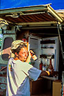 Petra taking beer out of fridge