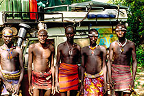 Karo warriers in front of landy (L)