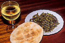 grasshopers on plate w bread & glass of white wine