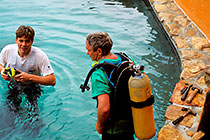Paul & Mike diving to repair cracks in pool w waterproof resine