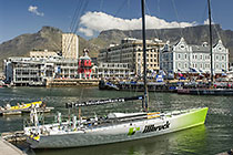 boats in waterfront harbour + old buildings + table mt + clouds