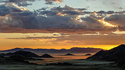dunes at sunset + clouds