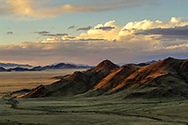 dunes at sunset + clouds