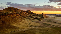 dunes at sunset + clouds