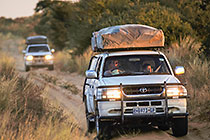 Friends driving on track in 4x4