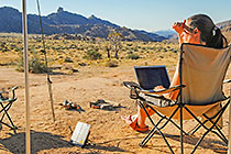 Petra working with laptop & satellite