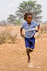 bushman children playing under rain storm