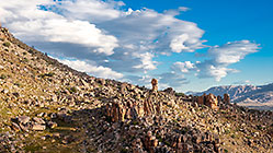rocks on mountain slope + clouds