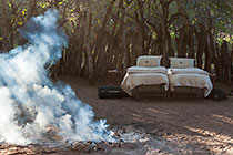 beds in boma surrounded by wood