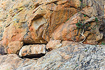 hole & stone in rocky hill