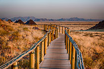 Sossus Dune Lodge bungalows at sunset
