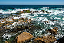 waves on rocky shore & pool