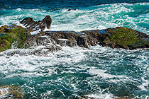 waves on rocky shore & pool