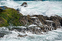 waves on rocky shore & pool