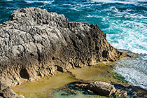 waves on rocky shore & pool