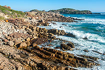 Marensia & James hiking along rocky seashore