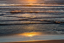 waves in Walker Bay at sunset