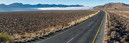 road with fog in desert