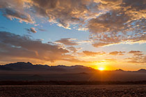 grass on sand dunes & mountains | clouds at sunset