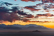 grass on sand dunes & mountains | clouds at sunset