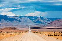 straight road to Namibrand plain & mountains