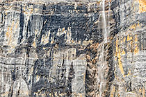 waterfall on mountain cliff