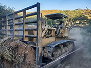 bulldozer making access road to plot