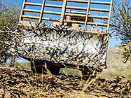 bulldozer making access road to plot