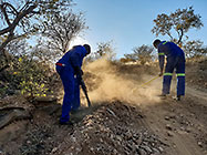 Donald & Sedney repairing access road to plot