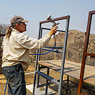 Paul spray painting sliding gate