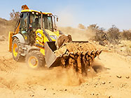 digger loader excavating foundations for workshop & studio
