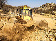 digger loader excavating foundations for workshop & studio