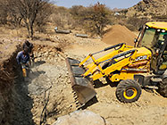 Donald & Sedney braking rocks & digger loader excavating foundations for workshop & studio