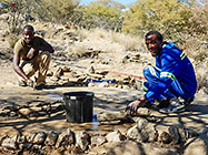 Donald & Sedney levelling concrete for  base for water tanks