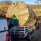 trailer with 10000 l water tank driving up hill