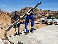 workers erecting columns of workshop steel portal