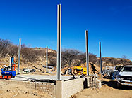 workers erecting columns of workshop steel portal