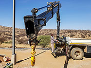 workers & crane truck erecting workshop steel portal